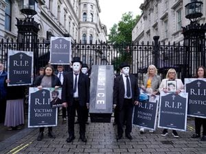 Representatives from Relatives for Justice, whose loved ones were murdered during the Troubles, protest in Parliament Square earlier this year