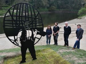 The iron sculpture of Ironbridge coracle man Tommy Rodgers with LtoR Marion Blockley,, sculptor Luke Perry, Graham Peet and  Wayne Owen (relative of the Rodgers family) picture by DAVID BAGNALL
