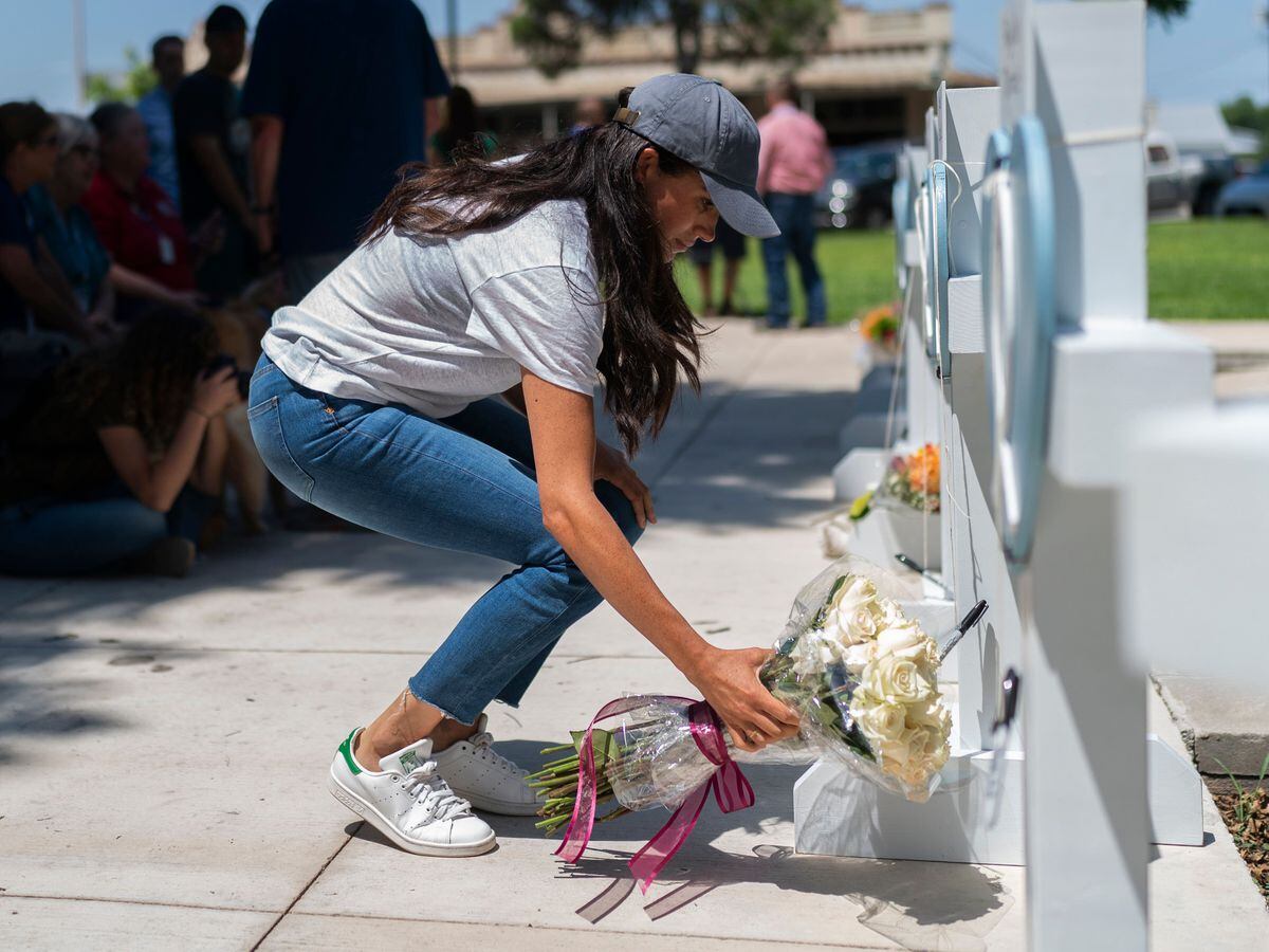 The Duchess of Sussex lays flowers at a memorial for the victims of the Texas school shooting