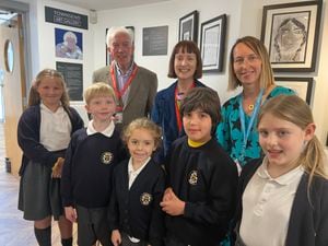 Pupils Mae Hilton, Arthur Taylor, Dolly Barber, Teddy Murray, Leica Waddington with Alan and Sally Townsend, and Tracy Othen from Coleham Primary School