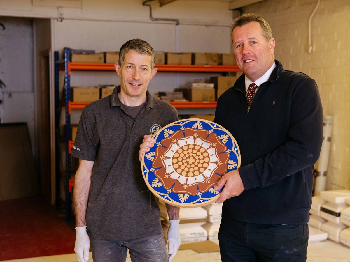  Leader of House of Commons Mark Spencer visits Craven Dunnill at Jackfield Museum in Telford. He is picture with Chris Cox (Head of Research and Development) with one of the  Central Lobby tiles which were installed at Westminster.