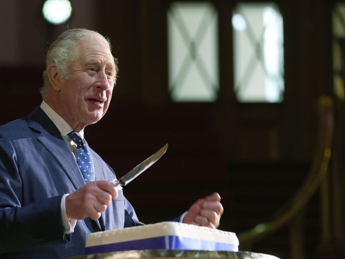 King Charles III cuts a cake to celebrate the 40th anniversary of Business in the Community