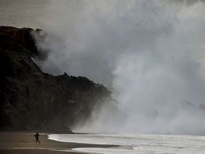 Large waves crash ashore at Wrights Beach, north of Bodega Bay, California, following a massive undersea volcanic explosion of the Hunga Tonga Hunga Haâapai volcano in Tonga. (Kent Porter/The Press Democrat via AP)
