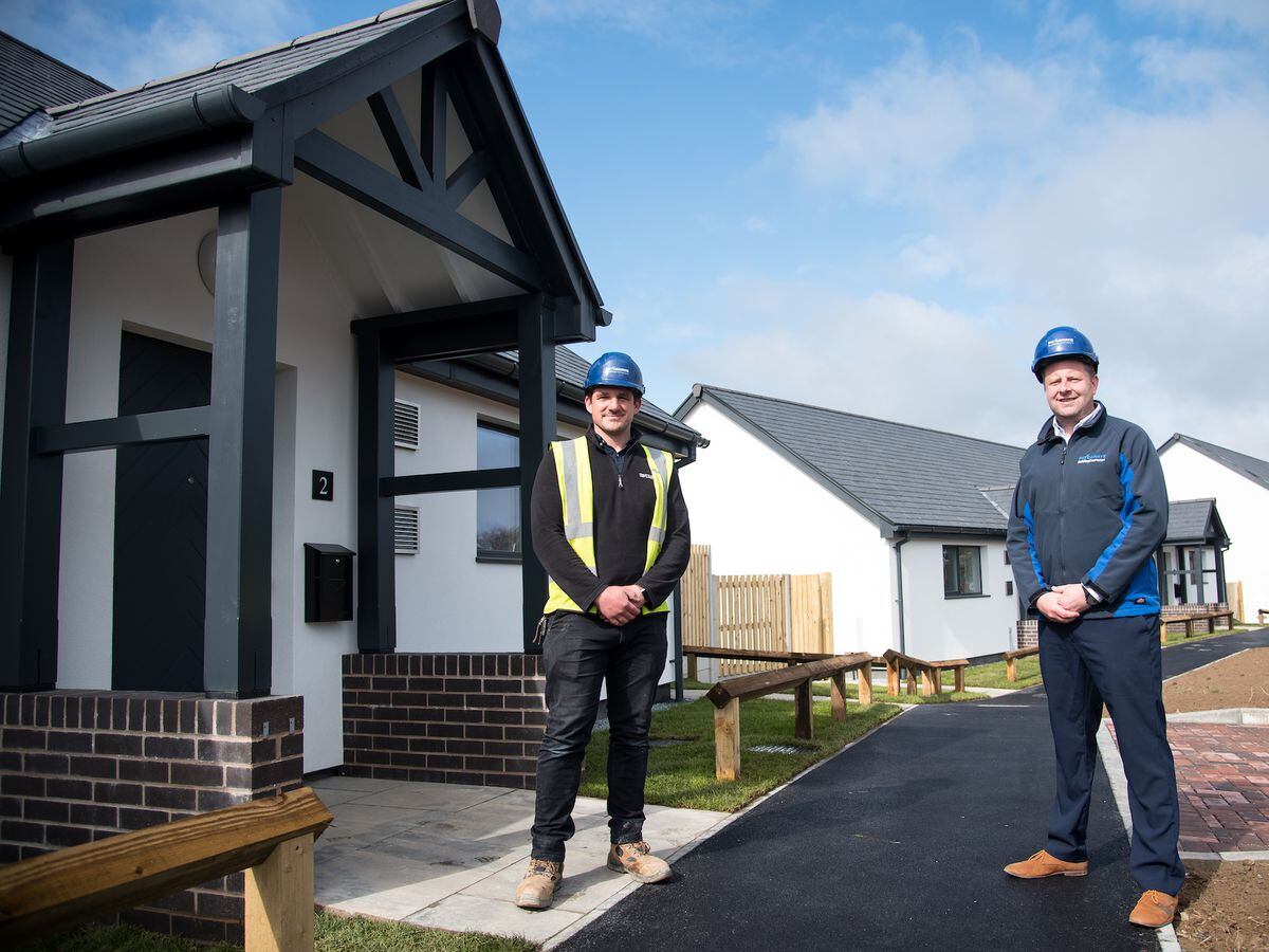 Pave Aways site manager Tom Ford and construction director Jamie Evans outside the Passivhaus homes in Sarn