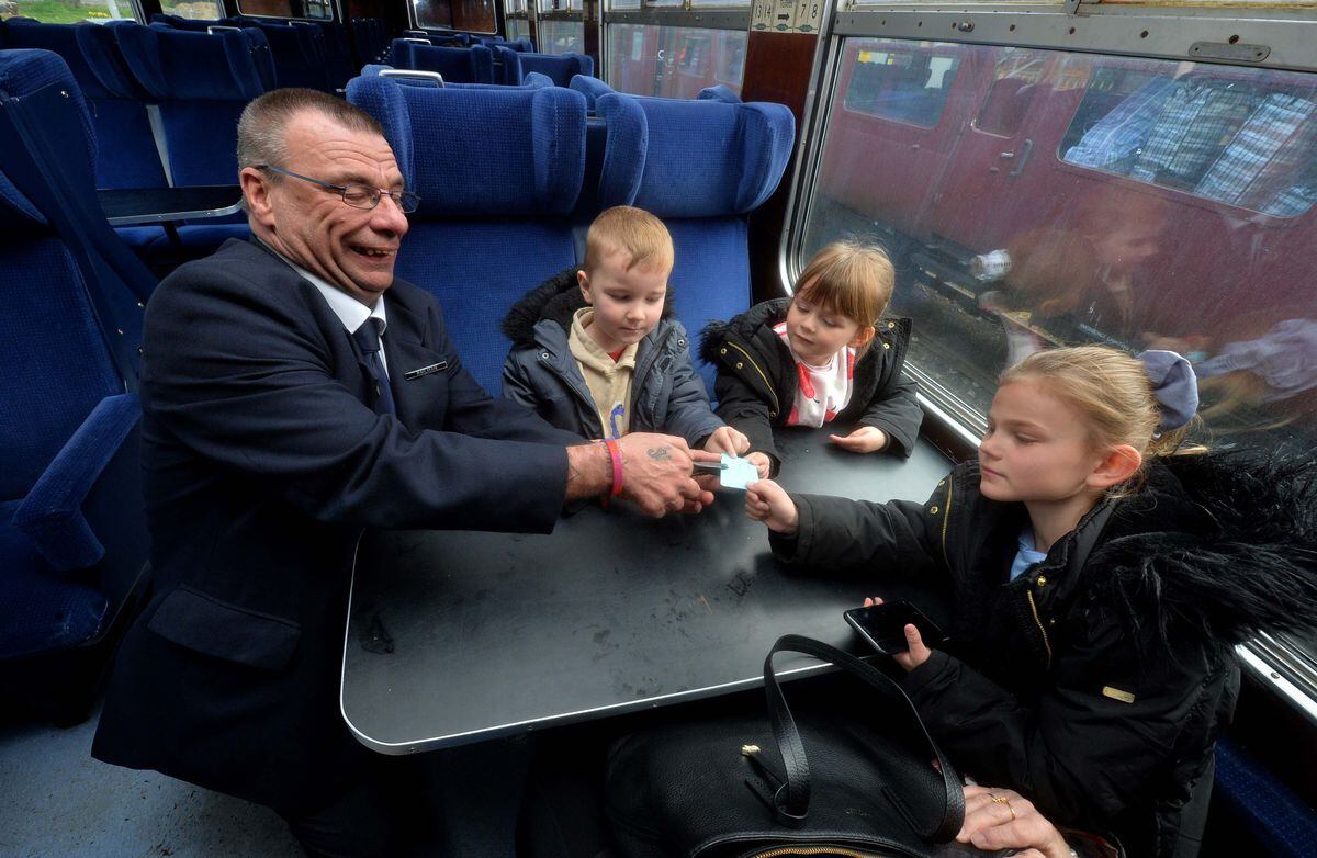 Ticket inspector John Ireland with Christopher Cooke, 5, Lyra Smith, 5, and Maddison Smith, 8.