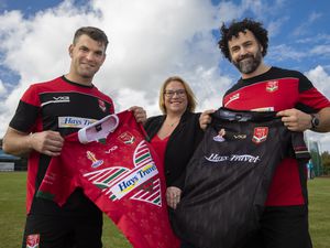 Hays Travel Toni Smith,  Regional Manager for Greater Manchester  with Wales Rugby players Elliot Kear and Rhys Williams.              Picture Mandy Jones