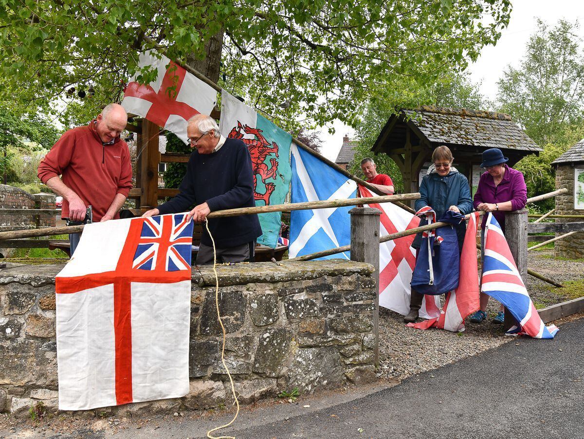 Aston-on-Clun Arbor Day organisers with their flags in 2021