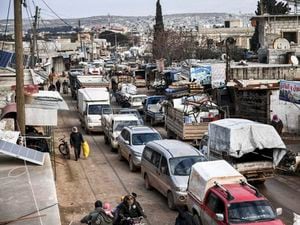 Civilians flee from Idlib towards the north to find safety inside Syria near the border with Turkey
