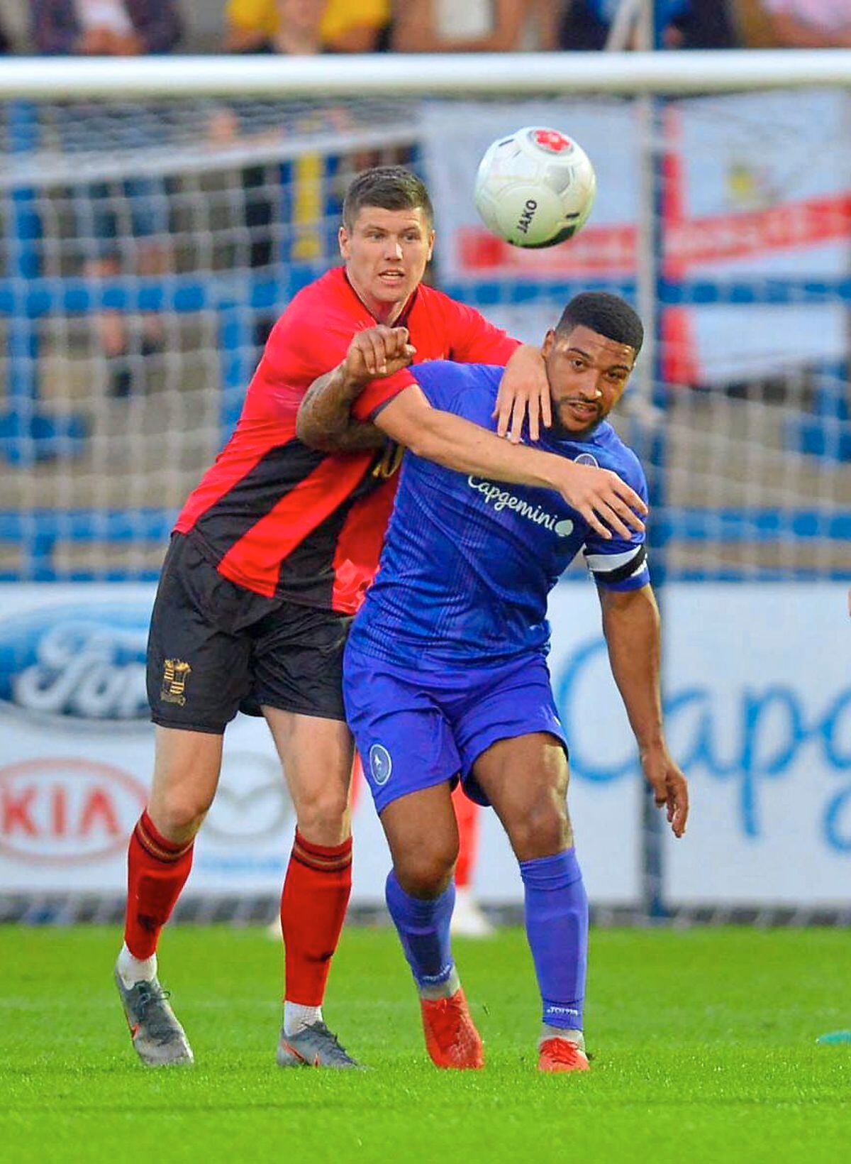 AFC Telford midfielder Ellis Deeney holds off the attention of Solihull’s Mitch Hancox