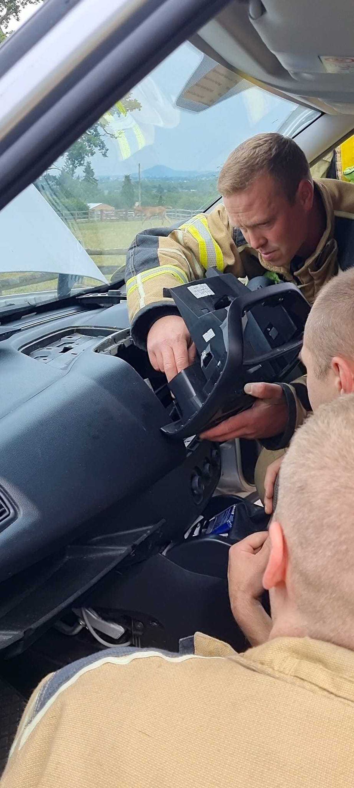 The firefighters get into the dashboard