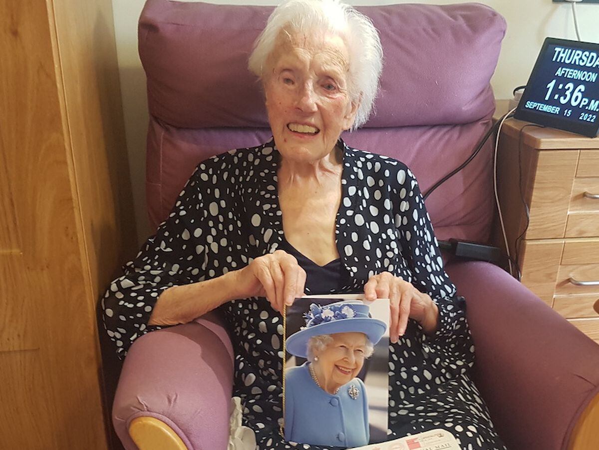 Mollie Blake with her card from The Queen