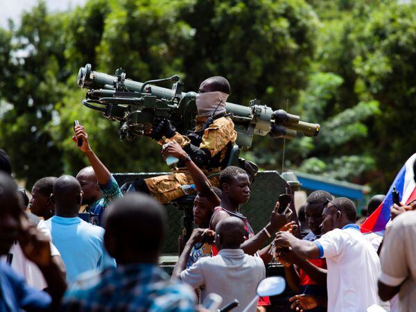 Soldiers loyal to Captain Ibrahim Traore are cheered in the streets of Ouagadougou in Burkina Faso on Sunday
