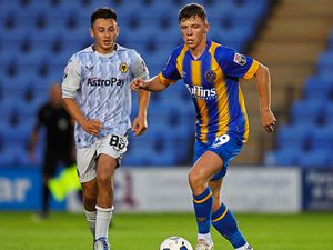 Charlie Caton of Shrewsbury Town and Dylan Scicluna of Wolverhampton Wanderers U21.