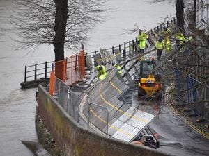 Environment Agency teams repair the temporary flood barriers in the Wharfage area of Ironbridge