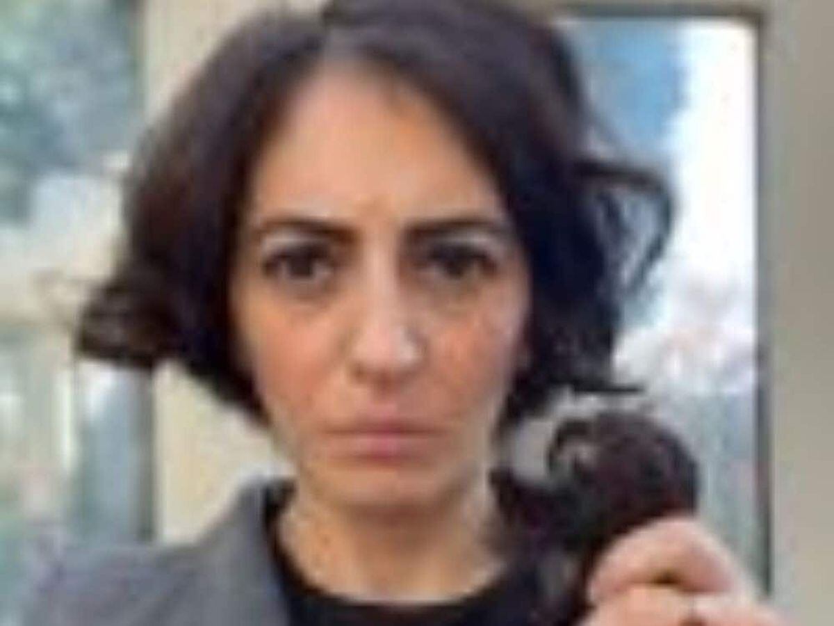 Elika Ashoori cutting her hair (PA)