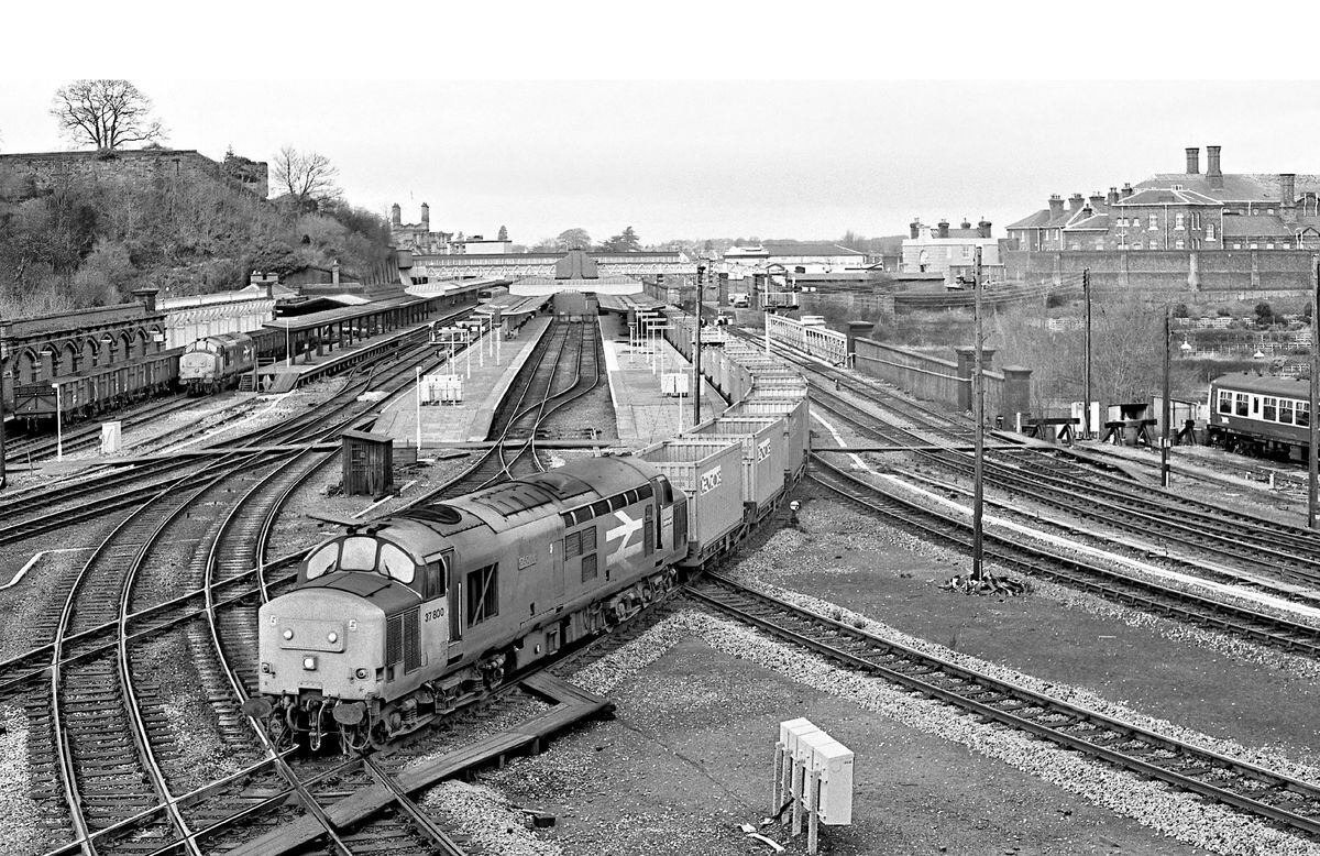 "Glo Cymru" takes the line at Shrewsbury to Sutton Bridge Junction with a train of empty coal containers on December 19, 1987.