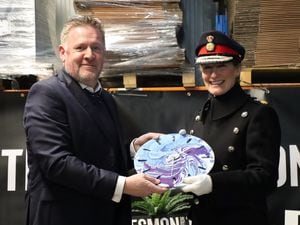 Jesmonite director and co-owner, Piran Littleton, presents Lord-Lieutenant of Shropshire Anna Turner with a clock made out of Jesmonite.