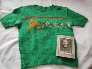 Valerie's coronation jumper knitted by her mum with a picture of Valerie wearing it in 1953