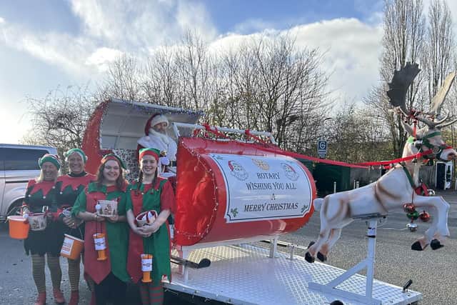 Caption: The Rotary sleigh and elves.