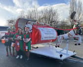 Caption: The Rotary sleigh and elves.