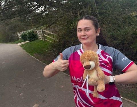 Grace Ashwell in training with Molly Ollys mascot Olly The Brave along for the ride.