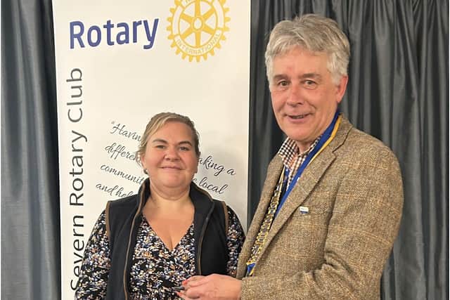 President Johnathan Callwood presents latest Shrewsbury Severn Rotary Club member Gemma Wasteney with her lapel badge.