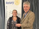 President Johnathan Callwood presents latest Shrewsbury Severn Rotary Club member Gemma Wasteney with her lapel badge.