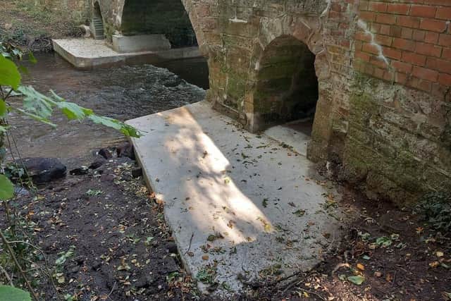 Defective concrete aprons supporting the bridge were removed and replaced to protect its stability and longevity