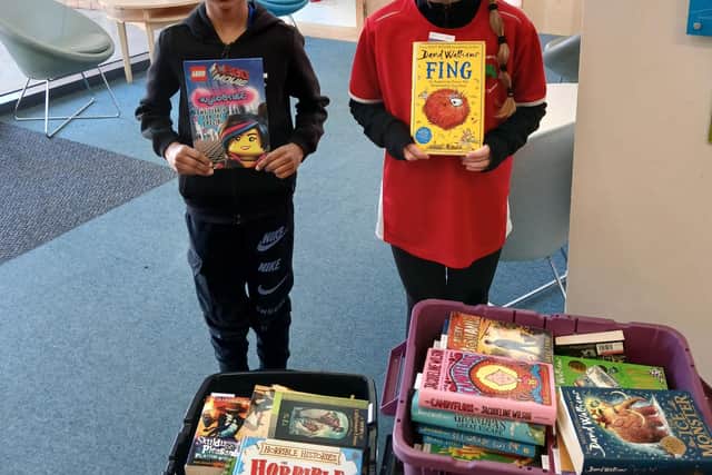 Pupils from Lightmoor Village Primary choosing their free pre-loved books, following their Reuse Competition win.