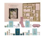 Champneys 24 Days of Spa Glow Advent Calendar contains body cleansers and lotions, bath milk and salts, an eye mask and fluffy socks.