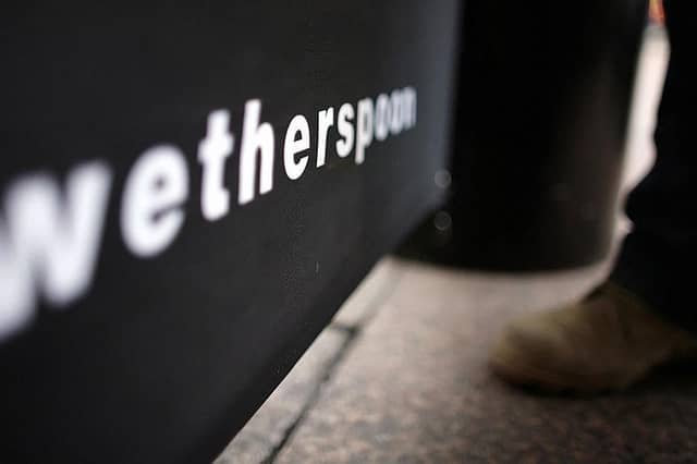 A man has claimed to have been removed from Wetherspoons while wearing a remembrance poppy
