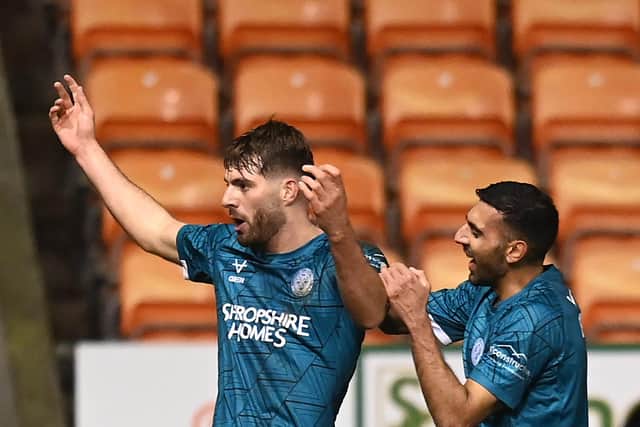 Tom Bloxham celebrates after scoring for Shrewsbury Town